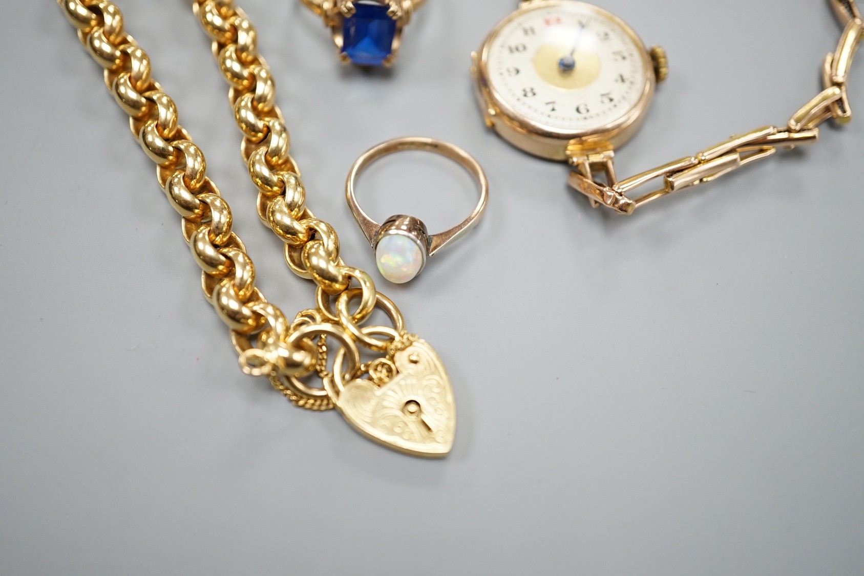 A modern 9ct gold bracelet, 18cm, 11.9 grams, two 9ct rings an a lady's 9ct gold manual wind wrist watch, on a 9ct bracelet, gross 20.7 grams.